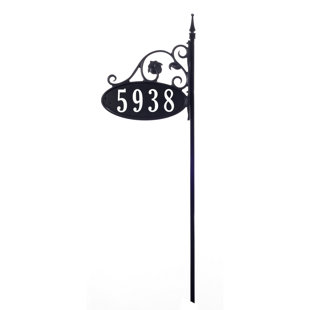 white lamp post with address sign
